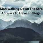 A Man Walking Down The Street Appears To Have an Illegal